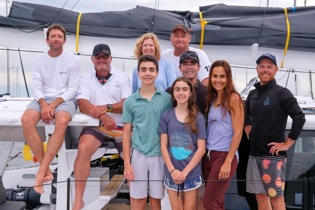 Larry Folsom poses with family and crew.