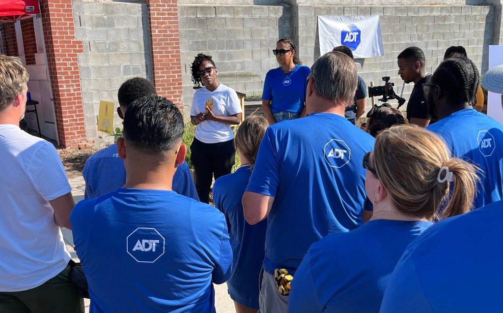 Nneka N’namdi, Founder and CEO of Fight Blight Bmore, speaks to Baltimore-area ADT employees at a check presentation and volunteer event in August. ADT presented N'namdi with a donation of $100,000 to support Fight Blight Bmore's efforts in the community.