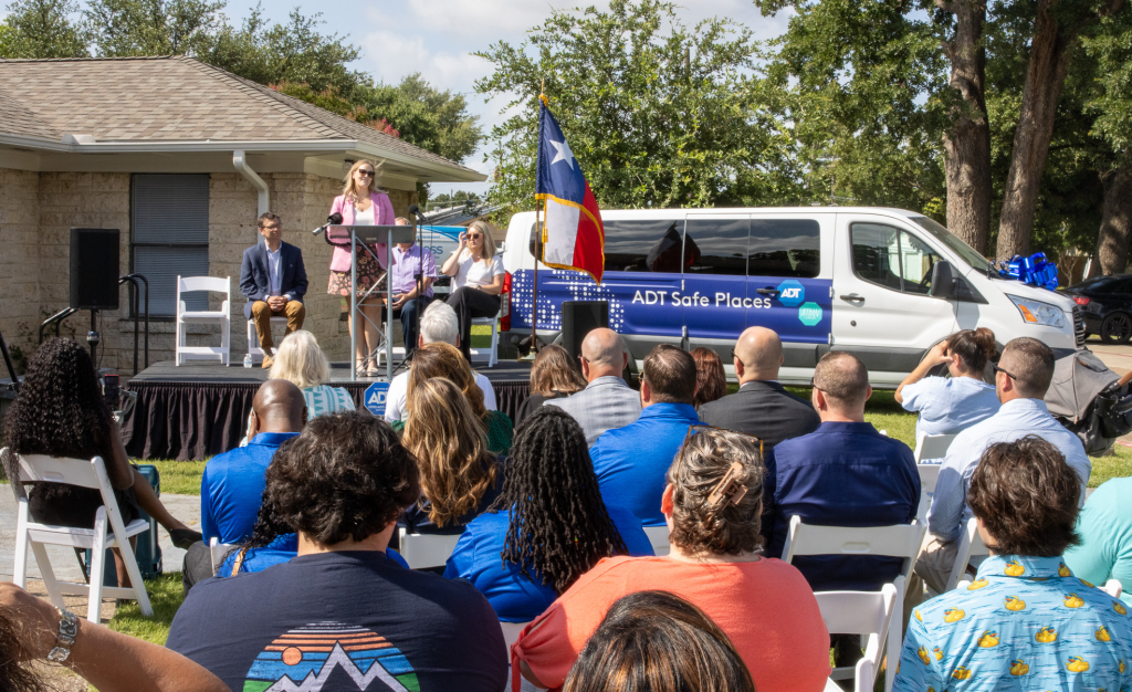 Amber Weaver, ADT's Vice President of Talent Acquisition and an All Things Made New board member, speaks at the introduction of one of the ADT Safe Places Drop-In Centers near Dallas.