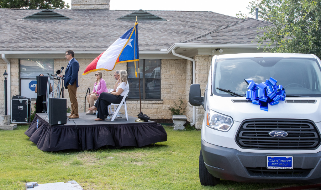 Dave Scott, ADT's Chief Administration and People Officer, speaks at the introduction of an ADT Safe Places Drop-In Center in Irving, Texas. ADT also funded a 10-passenger van to help ensure students can get to and from programs safely.
