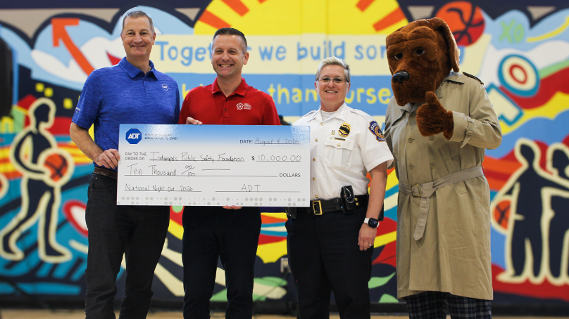 ADT CFO Jeff Likosar presents a donation to the  Indy Public Safety Foundation in Indianapolis on Aug. 4, 2026, ahead of a National Night Out event.